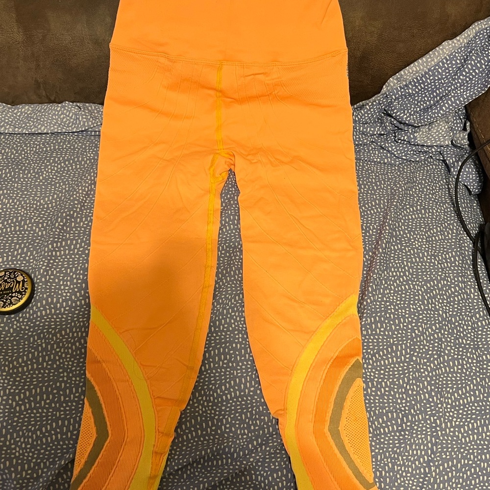 NWOT FP Movement by Free People Bright Orange and Yellow Leggings